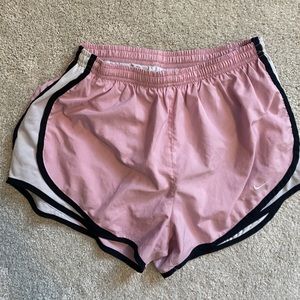 Pink and white Nike athletic shorts
